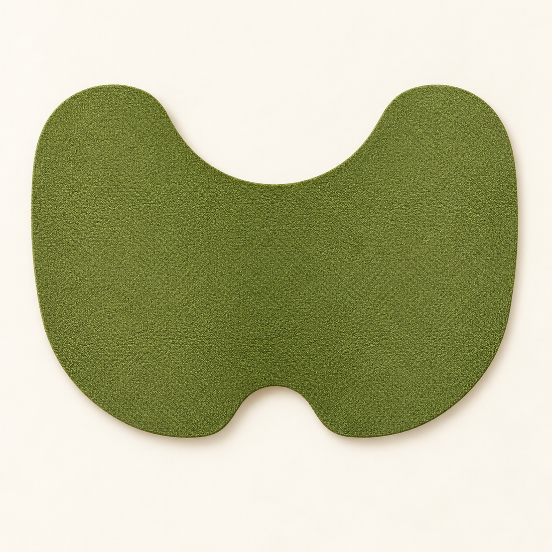 Green butterfly-shaped knee patch shown on a neutral background