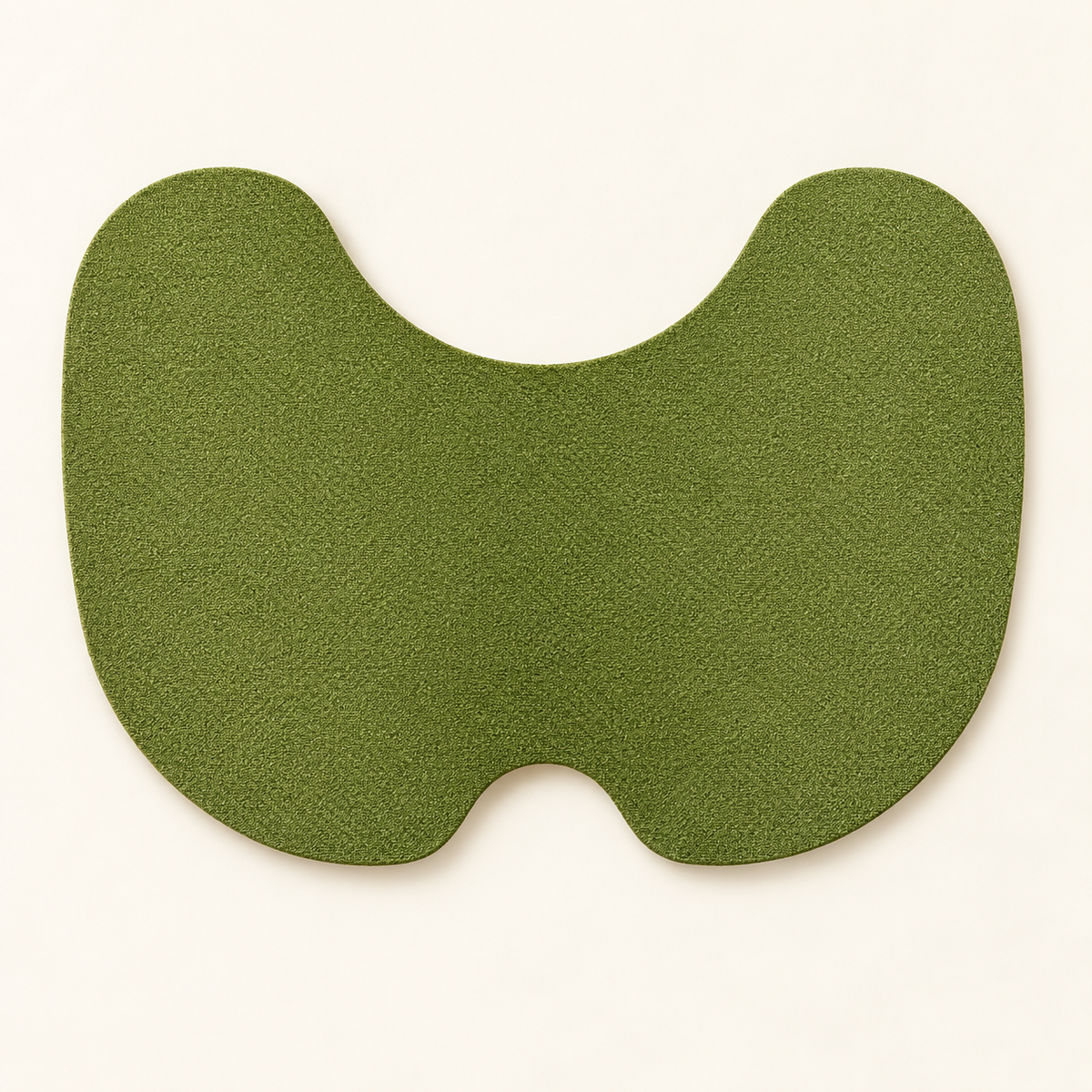 Green butterfly-shaped knee patch shown on a neutral background