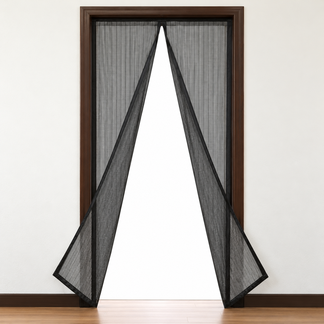 Black mesh magnetic door curtain with a central opening in a doorway